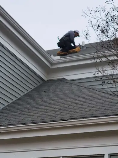 no limit roofing pipe boot repair technician on the roof