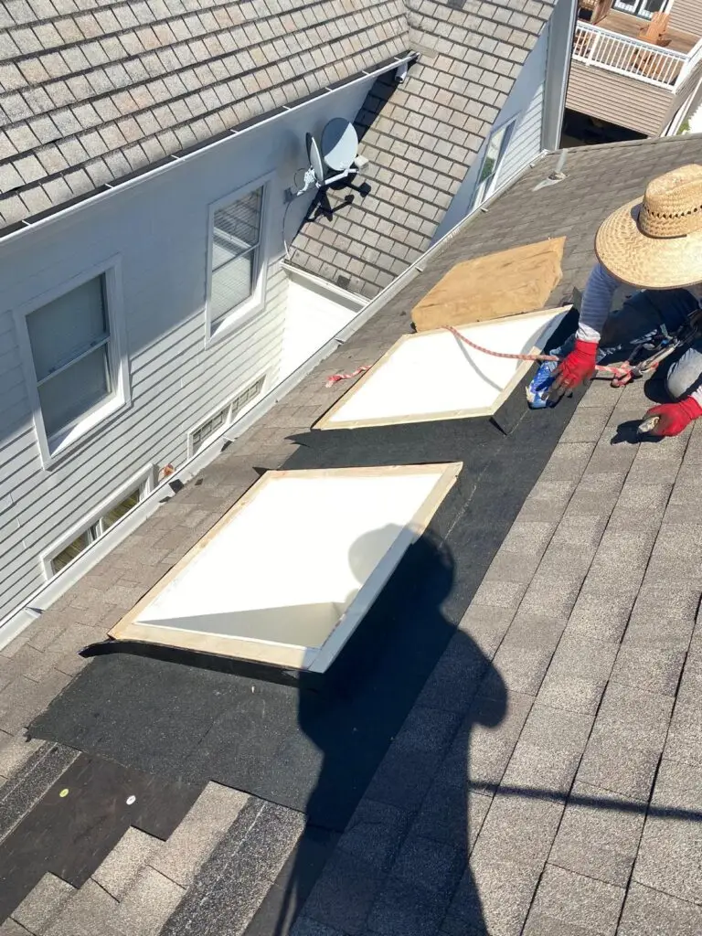 two new skylights being installed by no limit roofing in harbor town Memphis,tn